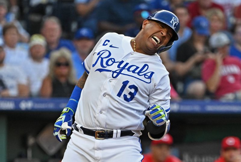 Jun 14, 2023; Kansas City, Missouri, USA;  Kansas City Royals designated hitter Salvador Perez (13) reacts after getting hit with a pitch in the third inning against the Cincinnati Reds]at Kauffman Stadium. Mandatory Credit: Peter Aiken-USA TODAY Sports