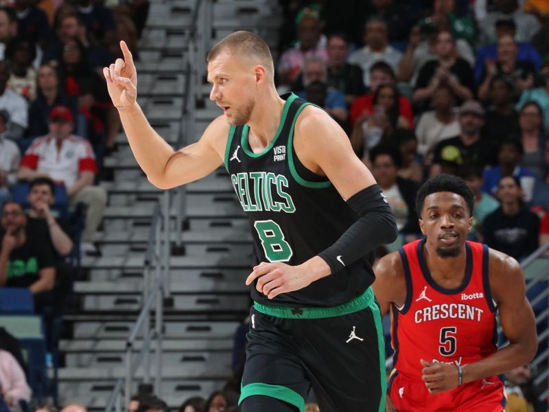 NEW ORLEANS, LA - MARCH 30: Kristaps Porzingis #8 of the Boston Celtics celebrates during the game against the New Orleans Pelicans on March 30, 2024 at the Smoothie King Center in New Orleans, Louisiana. NOTE TO USER: User expressly acknowledges and agrees that, by downloading and or using this Photograph, user is consenting to the terms and conditions of the Getty Images License Agreement. Mandatory Copyright Notice: Copyright 2024 NBAE (Photo by Layne Murdoch Jr./NBAE via Getty Images)