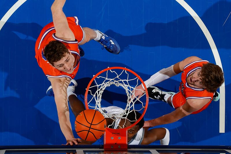 Jan 31, 2023; Colorado Springs, Colorado, USA; Air Force Falcons guard Ethan Taylor (5) watches his shot against Boise State Broncos forward Burke Smith (4) and guard Max Rice (12) in the second half at Clune Arena. Mandatory Credit: Isaiah J. Downing-USA TODAY Sports