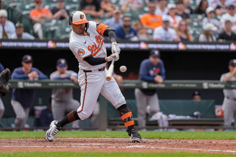 Aug 24, 2025; Baltimore, Maryland, USA; Baltimore Orioles second baseman Luis Vazquez (52) hits a home run against the Houston Astros during the seventh inning at Oriole Park at Camden Yards. Mandatory Credit: Gregory Fisher-Imagn Images