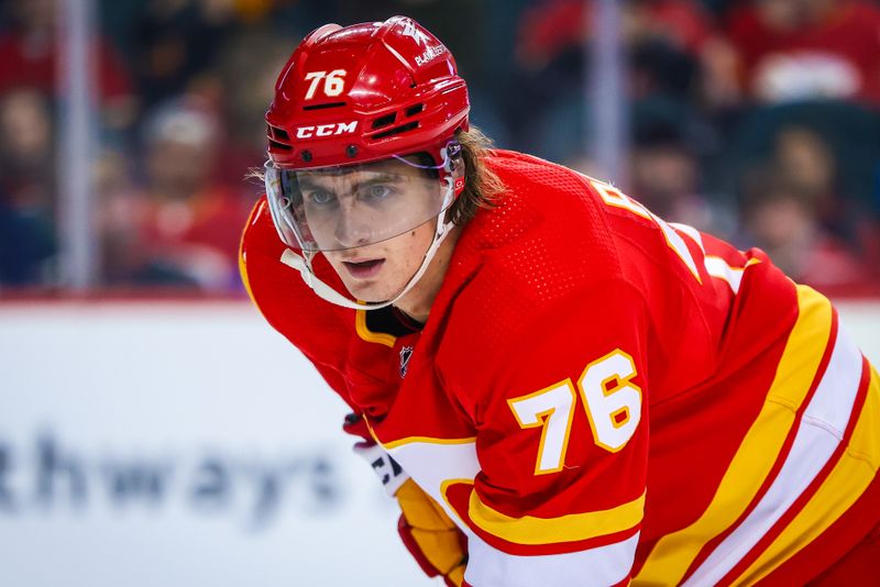 Mar 4, 2024; Calgary, Alberta, CAN; Calgary Flames center Martin Pospisil (76) during the face off against the Seattle Kraken during the second period at Scotiabank Saddledome. Mandatory Credit: Sergei Belski-USA TODAY Sports