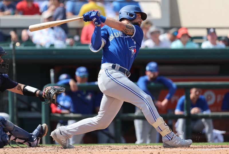 Mar 4, 2023; Lakeland, Florida, USA; Toronto Blue Jays outfielder Nathan Lukes (38) singles against the Detroit Tigers during the fourth inning at Publix Field at Joker Marchant Stadium. Mandatory Credit: Kim Klement-USA TODAY Sports