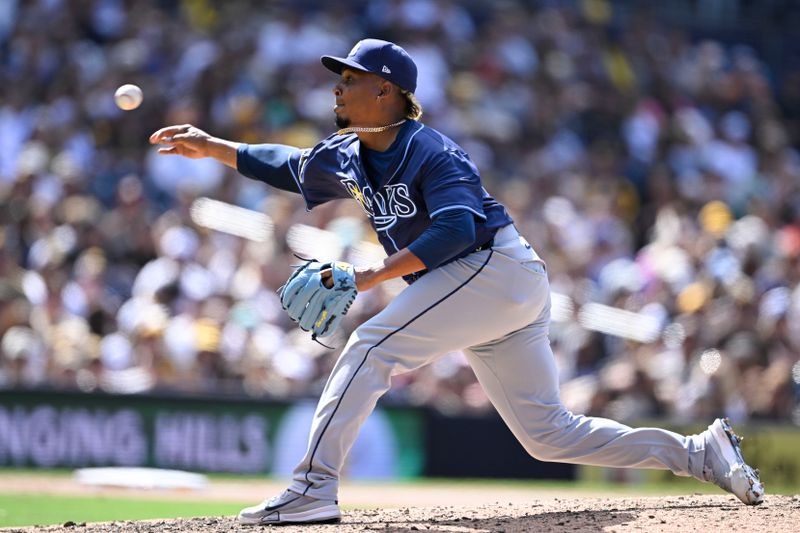 Apr 27, 2025; San Diego, California, USA; Tampa Bay Rays relief pitcher Edwin Uceta (63) delivers during the eighth inning against the Tampa Bay Rays at Petco Park. Mandatory Credit: Denis Poroy-Imagn Images