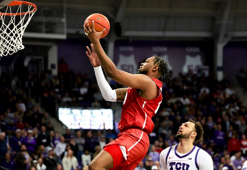 Jan 13, 2024; Fort Worth, Texas, USA; Houston Cougars forward J'Wan Roberts (13) shoots pasy TCU Horned Frogs forward JaKobe Coles (21) during the second half  at Ed and Rae Schollmaier Arena. Mandatory Credit: Kevin Jairaj-USA TODAY Sports