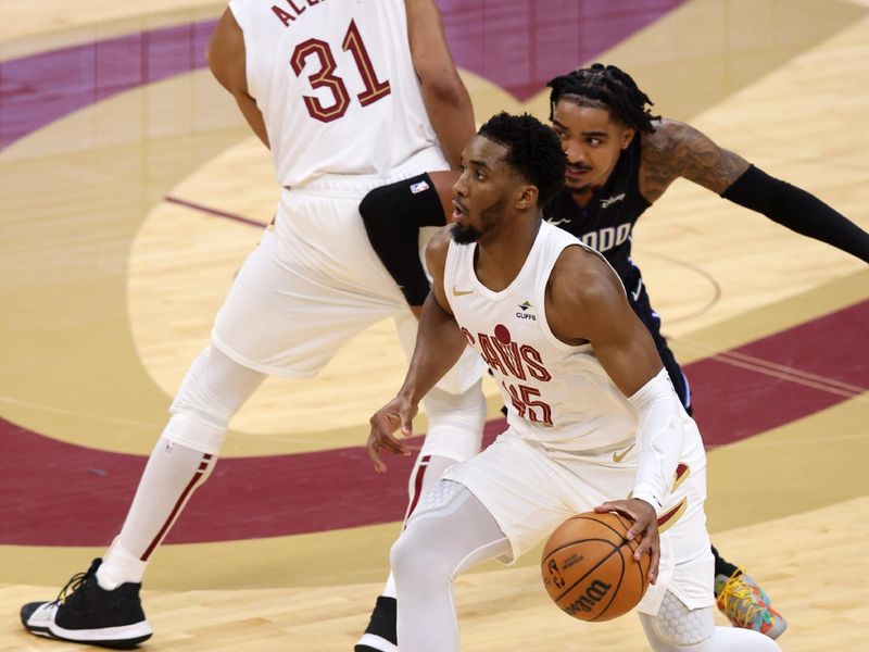 CLEVELAND, OH - APRIL 20: Donovan Mitchell #45 of the Cleveland Cavaliers handles the ball during Round One Game One of the 2024 NBA Playoffs against the Orlando Magic on April 20, 2024 at Rocket Mortgage FieldHouse in Cleveland, Ohio. NOTE TO USER: User expressly acknowledges and agrees that, by downloading and/or using this Photograph, user is consenting to the terms and conditions of the Getty Images License Agreement. Mandatory Copyright Notice: Copyright 2024 NBAE (Photo by  Lauren Leigh Bacho/NBAE via Getty Images)