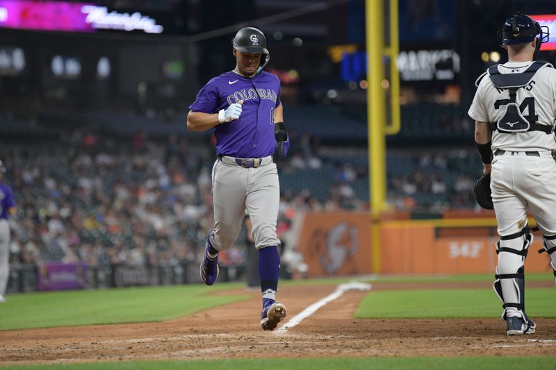 Sep 11, 2024; Detroit, Michigan, USA; Colorado Rockies shortstop Ezequiel Tovar (14) scores a run on an RBI single by center fielder Brenton Doyle (not pictured) against the Detroit Tigers in the fifth inning at Comerica Park. Mandatory Credit: Lon Horwedel-Imagn Images