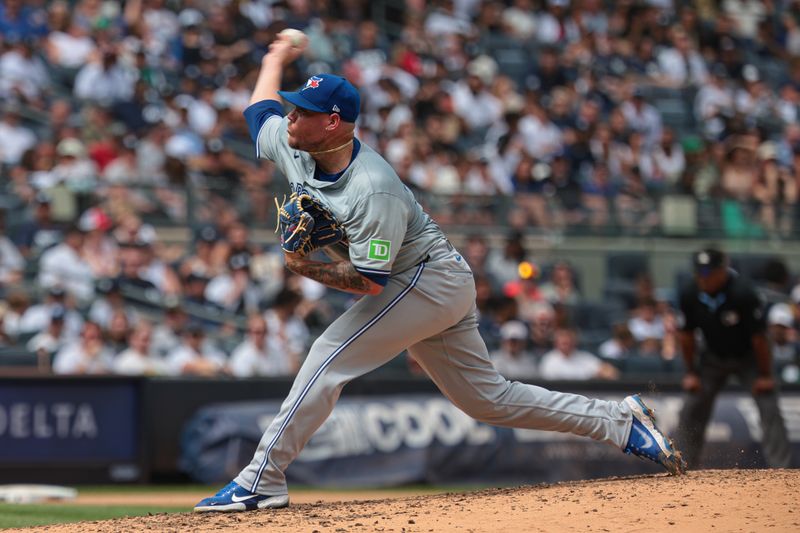 Aug 4, 2024; Bronx, New York, USA; Toronto Blue Jays starting pitcher Yariel Rodriguez (29) delivers a pitch during the fourth inning against the New York Yankees  at Yankee Stadium. Mandatory Credit: Vincent Carchietta-USA TODAY Sports