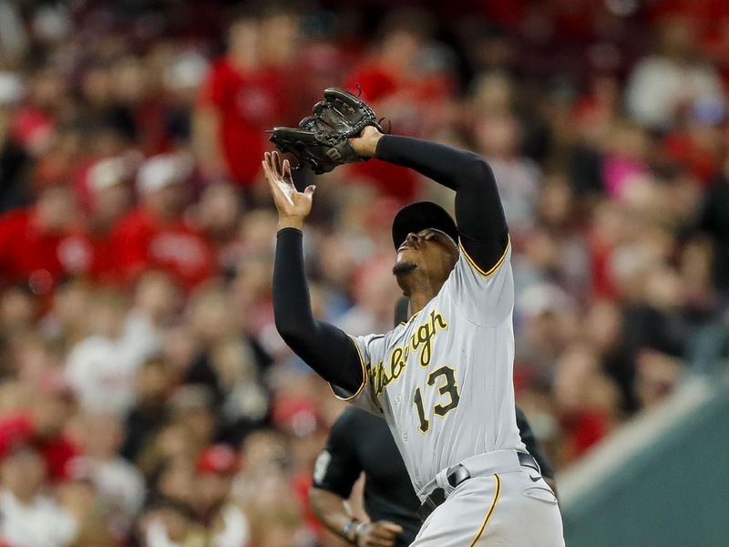 Sep 22, 2023; Cincinnati, Ohio, USA; Pittsburgh Pirates third baseman Ke'Bryan Hayes (13) catches a pop up hit by Cincinnati Reds first baseman Joey Votto (not pictured) in the seventh inning at Great American Ball Park. Mandatory Credit: Katie Stratman-USA TODAY Sports