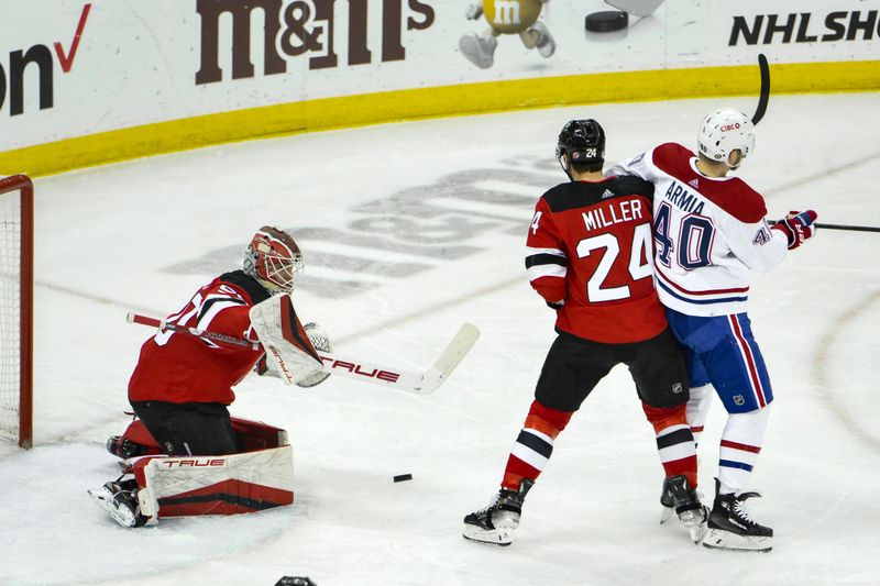 Feb 24, 2024; Newark, New Jersey, USA; New Jersey Devils goaltender Nico Daws (50) makes a save against the Montreal Canadiens during the third period at Prudential Center. Mandatory Credit: John Jones-USA TODAY Sports