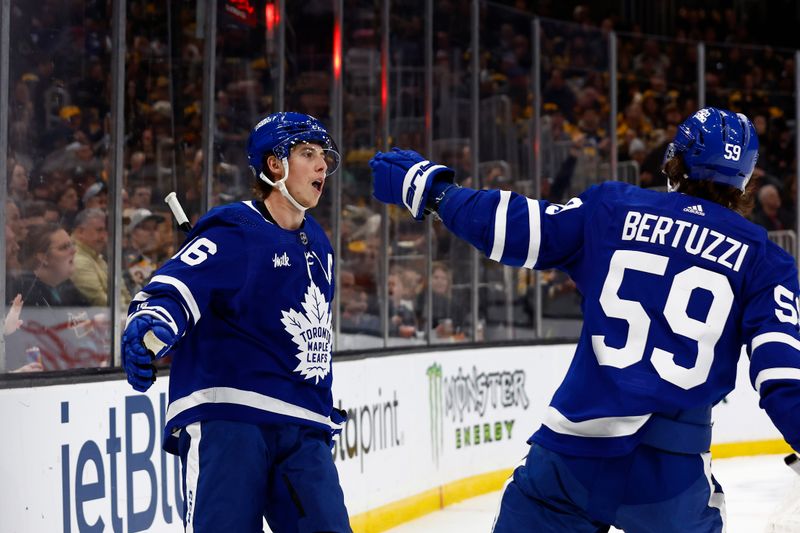 Mar 7, 2024; Boston, Massachusetts, USA; Toronto Maple Leafs right wing Mitchell Marner (16) is congratulated by left wing Tyler Bertuzzi (59) after his goal against the Boston Bruins during the second period at TD Garden. Mandatory Credit: Winslow Townson-USA TODAY Sports