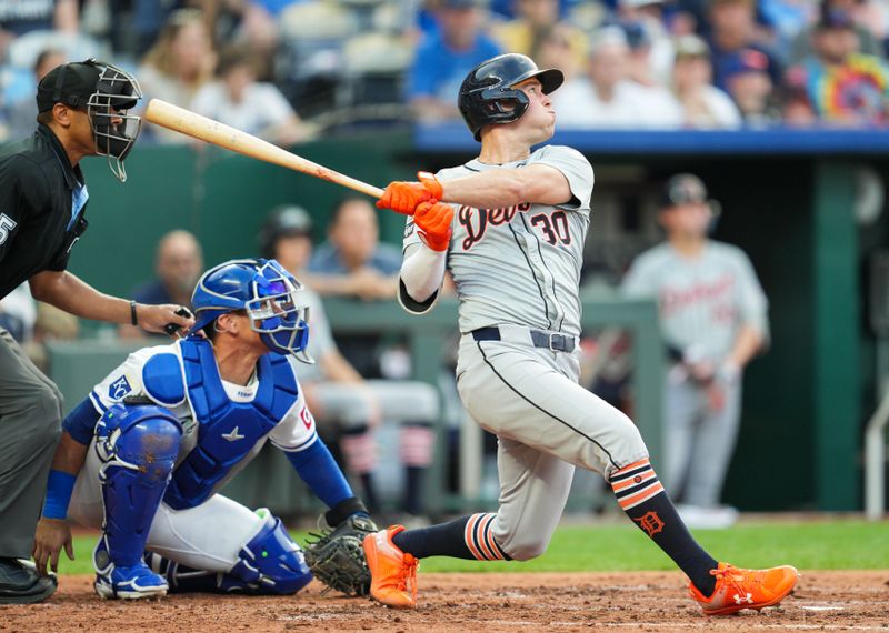 May 20, 2024; Kansas City, Missouri, USA; Detroit Tigers right fielder Kerry Carpenter (30) hits a home run against the Kansas City Royals during the fourth inning at Kauffman Stadium. Mandatory Credit: Jay Biggerstaff-USA TODAY Sports