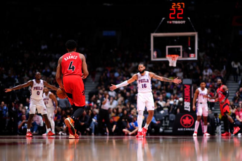 TORONTO, CANADA - OCTOBER 25: Scottie Barnes #4 of the Toronto Raptors brings the ball up court during the game against the Philadelphia 76ers on October 25, 2024 at the Scotiabank Arena in Toronto, Ontario, Canada.  NOTE TO USER: User expressly acknowledges and agrees that, by downloading and or using this Photograph, user is consenting to the terms and conditions of the Getty Images License Agreement.  Mandatory Copyright Notice: Copyright 2024 NBAE (Photo by Mark Blinch/NBAE via Getty Images)