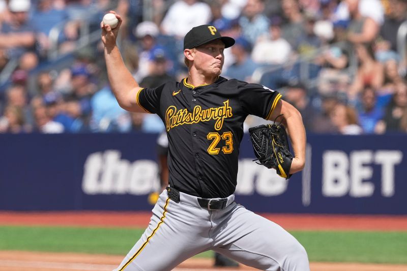 Jun 1, 2024; Toronto, Ontario, CAN;  Pittsburgh Pirates starting pitcher Mitch Keller (23) throws against the Toronto Blue Jays during the second inning at Rogers Centre. Mandatory Credit: John E. Sokolowski-USA TODAY Sports