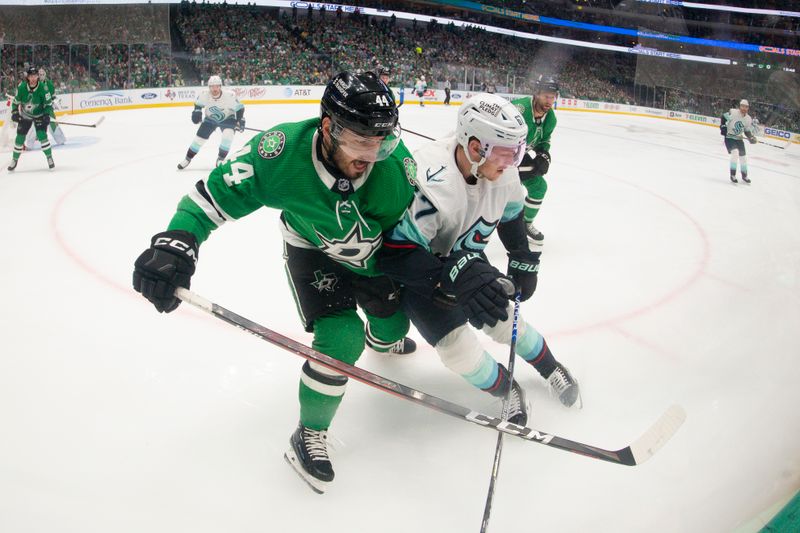 May 15, 2023; Dallas, Texas, USA; Dallas Stars defenseman Joel Hanley (44) and Seattle Kraken center Morgan Geekie (67) battle for control of the puck in the Stars zone during the first period in game seven of the second round of the 2023 Stanley Cup Playoffs at the American Airlines Center. Mandatory Credit: Jerome Miron-USA TODAY Sports