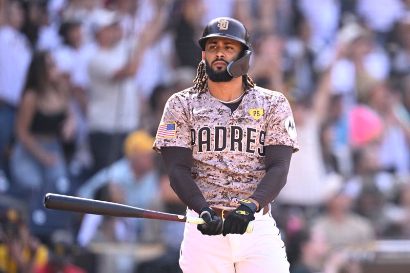 Sep 22, 2024; San Diego, California, USA; San Diego Padres designated hitter Fernando Tatis Jr. (23) hits a home run against the Chicago White Sox during the eighth inning at Petco Park. Mandatory Credit: Orlando Ramirez-Imagn Images