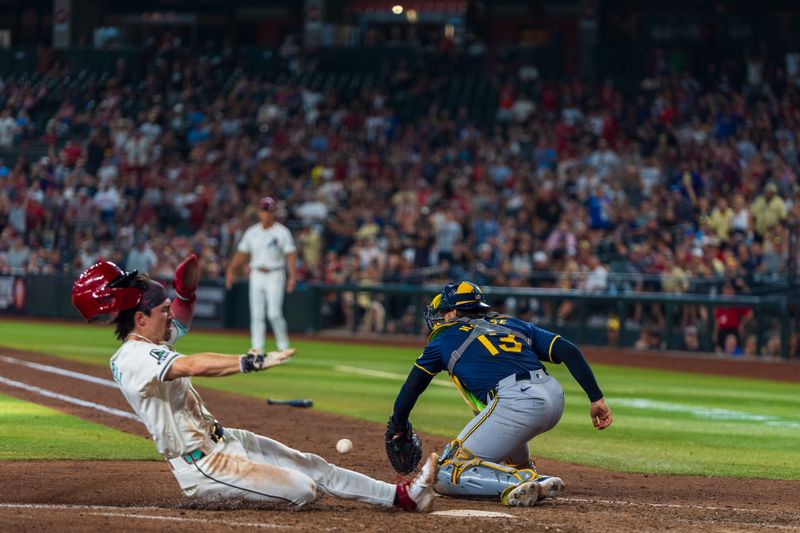 Sep 15, 2024; Phoenix, Arizona, USA; Milwaukee Brewers catcher Eric Haase (13) reaches out to field the ball as Arizona Diamondbacks outfielder Corbin Carroll (7) comes in to score in the eighth inning during a game at Chase Field. Mandatory Credit: Allan Henry-Imagn Images