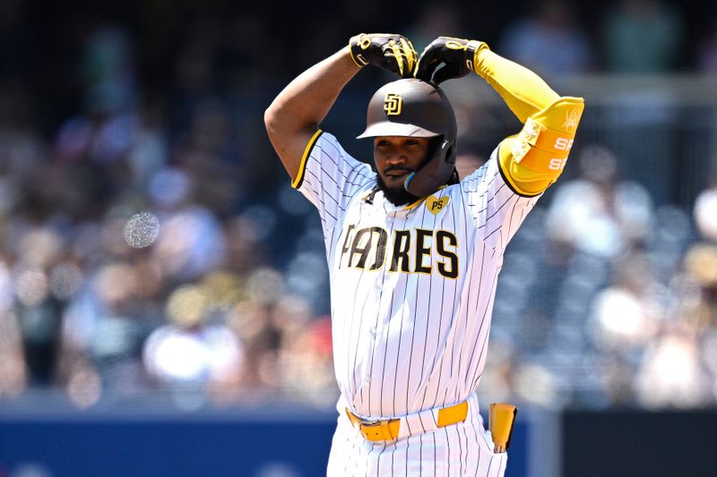 Jun 26, 2024; San Diego, California, USA; San Diego Padres third baseman Eguy Rosario (5) celebrates after hitting a double during the fourth inning against the Washington Nationals at Petco Park. Mandatory Credit: Orlando Ramirez-USA TODAY Sports