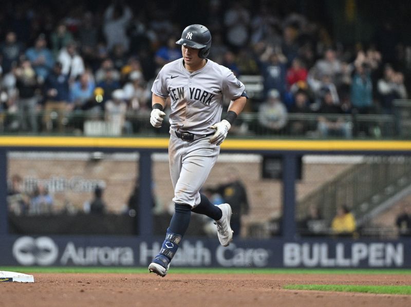 Apr 28, 2024; Milwaukee, Wisconsin, USA; New York Yankees shortstop Anthony Volpe (11) rounds the bases after hitting a home run against the Milwaukee Brewers in the fifth inning at American Family Field. Mandatory Credit: Michael McLoone-USA TODAY Sports