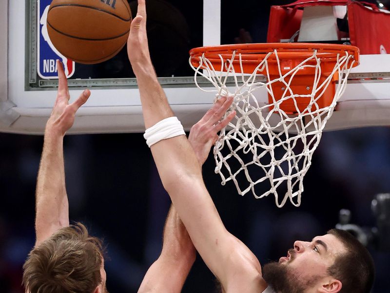 LOS ANGELES, CALIFORNIA - FEBRUARY 25: Domantas Sabonis #10 of the Sacramento Kings puts up a layup against Ivica Zubac #40 of the Los Angeles Clippers during the second quarter at Crypto.com Arena on February 25, 2024 in Los Angeles, California. NOTE TO USER: User expressly acknowledges and agrees that, by downloading and or using this photograph, User is consenting to the terms and conditions of the Getty Images License Agreement.  (Photo by Katelyn Mulcahy/Getty Images)