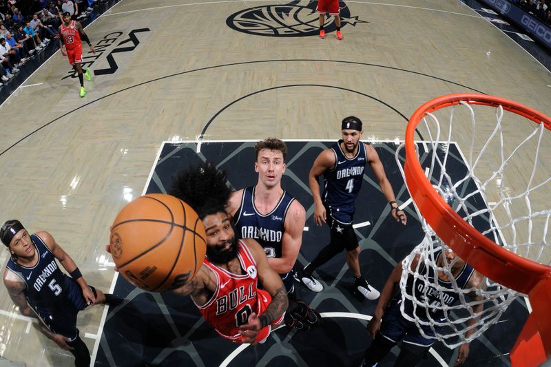 ORLANDO, FL - APRIL 7: Coby White #0 of the Chicago Bulls drives to the basket during the game against the Orlando Magic on April 7, 2024 at the Kia Center in Orlando, Florida. NOTE TO USER: User expressly acknowledges and agrees that, by downloading and or using this photograph, User is consenting to the terms and conditions of the Getty Images License Agreement. Mandatory Copyright Notice: Copyright 2024 NBAE (Photo by Fernando Medina/NBAE via Getty Images)