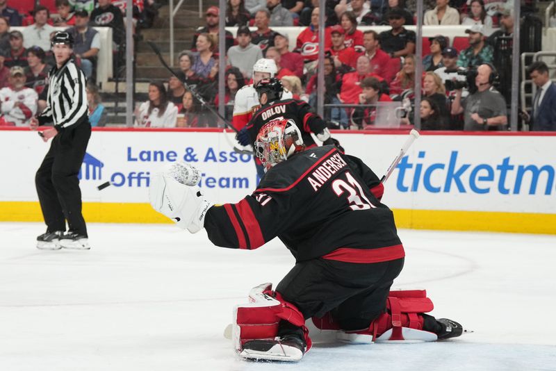 May 22, 2025; Raleigh, North Carolina, USA;  Carolina Hurricanes goaltender Frederik Andersen (31) reaches for a shot on goal during the second period against the Florida Panthers in game two of the Eastern Conference Final of the 2025 Stanley Cup Playoffs at Lenovo Center. Mandatory Credit: James Guillory-Imagn Images
