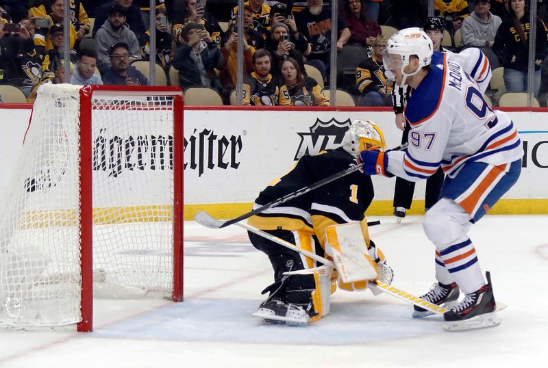 Feb 23, 2023; Pittsburgh, Pennsylvania, USA; Edmonton Oilers center Connor McDavid (97) scores a goal on a penalty shot against Pittsburgh Penguins goaltender Casey DeSmith (1) during the third period at PPG Paints Arena. Edmonton won 7-2. Mandatory Credit: Charles LeClaire-USA TODAY Sports