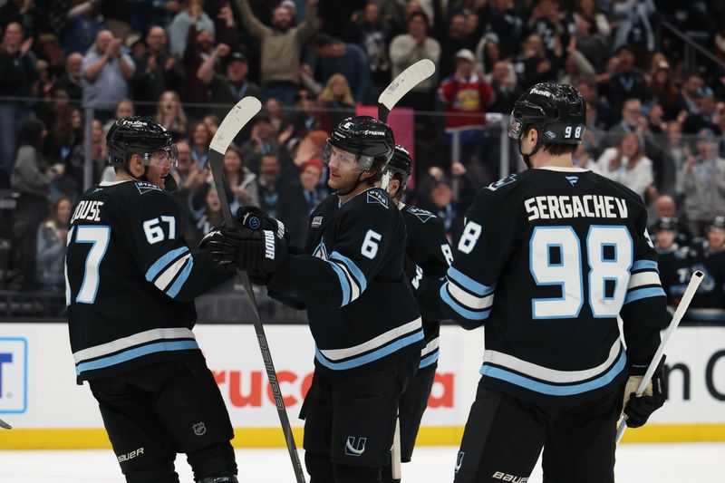 Feb 2, 2026; Salt Lake City, Utah, USA; The Utah Mammoth celebrate a goal by left wing Lawson Crouse (67) during the second period against the Vancouver Canucks at Delta Center. Mandatory Credit: Rob Gray-Imagn Images