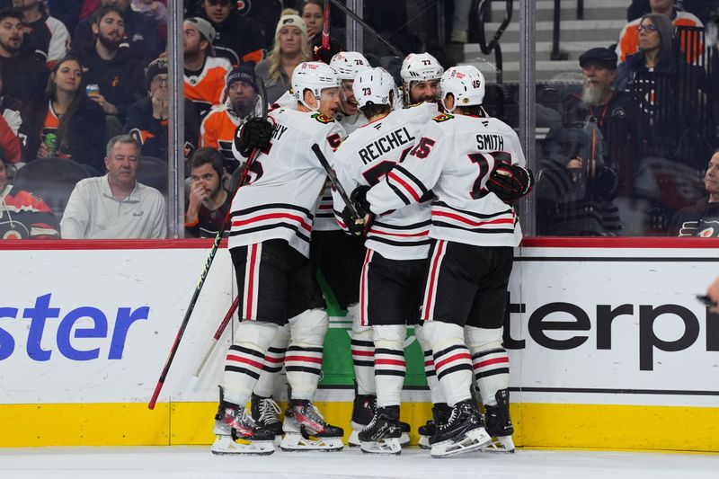 Nov 23, 2024; Philadelphia, Pennsylvania, USA; Chicago Blackhawks left wing Patrick Maroon (77) celebrates with teammates after scoring a goal against the Philadelphia Flyers in the second period at Wells Fargo Center. Mandatory Credit: Kyle Ross-Imagn Images