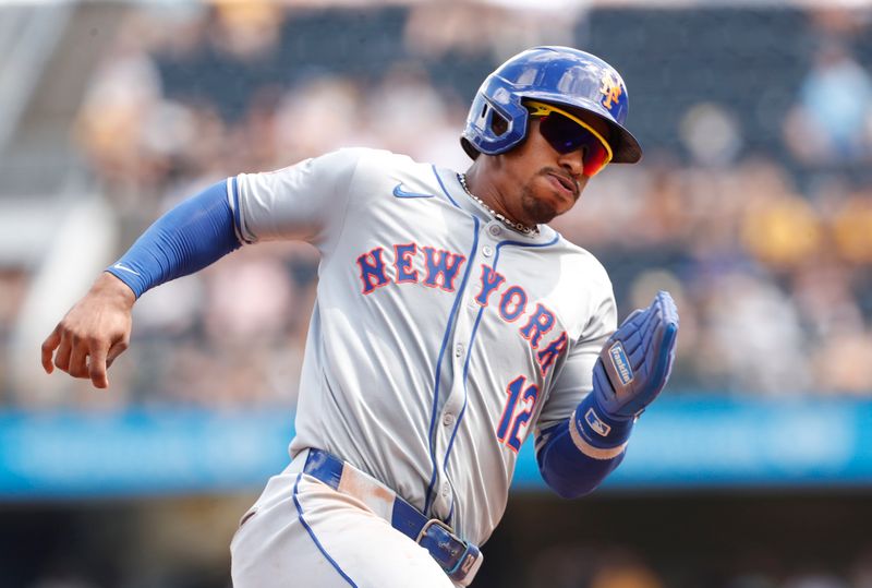 Jul 7, 2024; Pittsburgh, Pennsylvania, USA;  New York Mets shortstop Francisco Lindor (12) runs the bases on his way to scoring a run against the Pittsburgh Pirates during the eighth inning at PNC Park. The Mets won 3-2. Mandatory Credit: Charles LeClaire-USA TODAY Sports