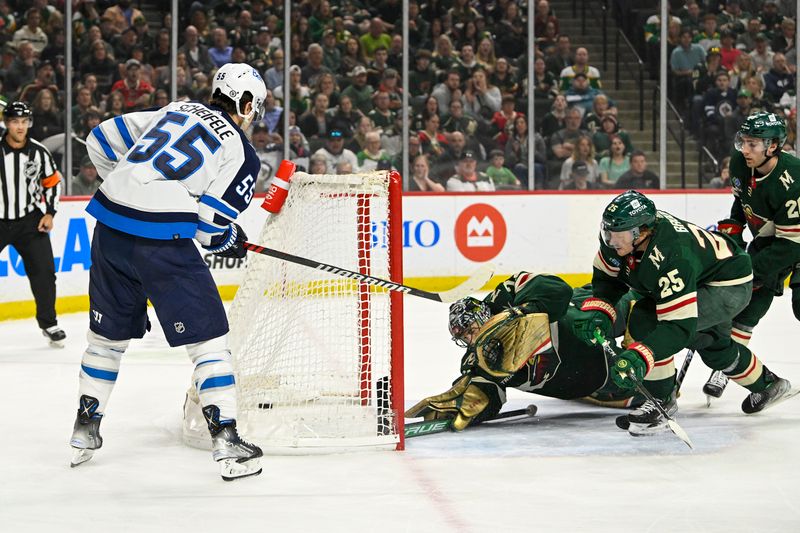 Apr 11, 2023; Saint Paul, Minnesota, USA;  Winnipeg Jets forward Mark Scheifele (55) scores a goal against the Minnesota Wild during the first period at at Xcel Energy Center. Mandatory Credit: Nick Wosika-USA TODAY Sports