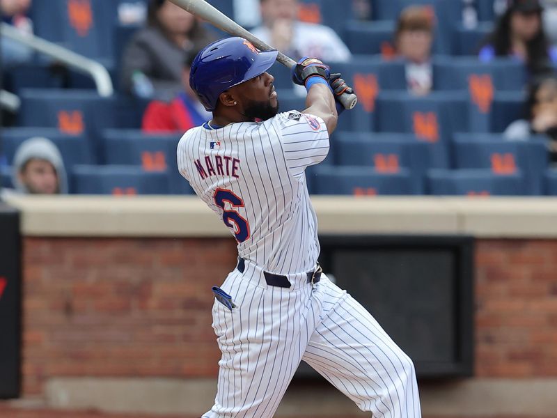 Apr 17, 2024; New York City, New York, USA; New York Mets designated hitter Starling Marte (6) follows through on a two run home run against the Pittsburgh Pirates during the third inning at Citi Field. Mandatory Credit: Brad Penner-USA TODAY Sports