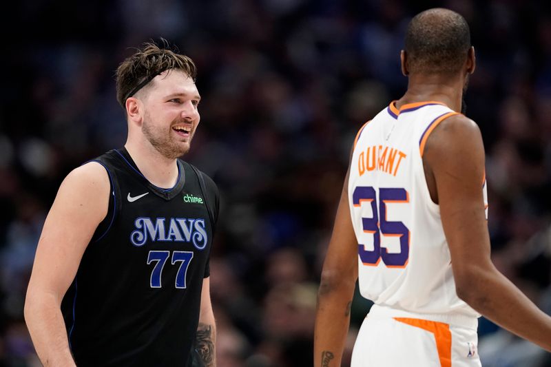 DALLAS, TEXAS - JANUARY 24: Luka Doncic #77 of the Dallas Mavericks and Kevin Durant #35 of the Phoenix Suns look on during the first half at American Airlines Center on January 24, 2024 in Dallas, Texas. NOTE TO USER: User expressly acknowledges and agrees that, by downloading and or using this photograph, User is consenting to the terms and conditions of the Getty Images License Agreement. (Photo by Sam Hodde/Getty Images)