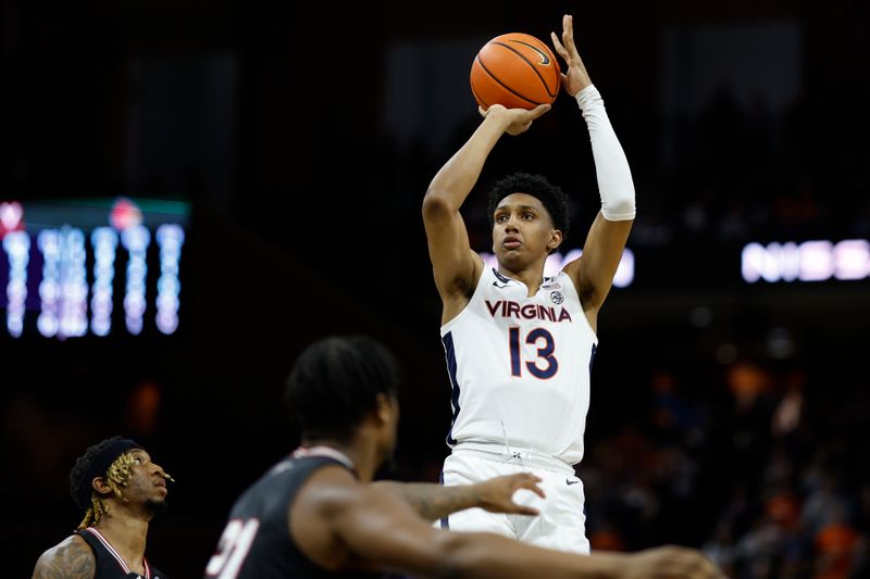 Mar 4, 2023; Charlottesville, Virginia, USA;  Virginia Cavaliers guard Ryan Dunn (13) shoots the ball over Louisville Cardinals guard El Ellis (3) in the second half at John Paul Jones Arena. Mandatory Credit: Geoff Burke-USA TODAY Sports