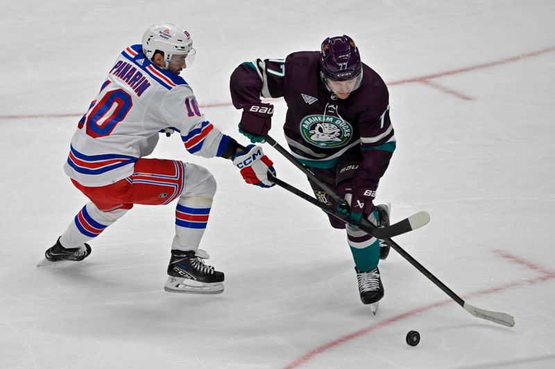 Jan 21, 2024; Anaheim, California, USA; New York Rangers left wing Artemi Panarin (10) and Anaheim Ducks right wing Frank Vatrano (77) go for the puck in the second period at Honda Center. Mandatory Credit: Jayne Kamin-Oncea-USA TODAY Sports