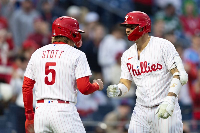 Apr 26, 2023; Philadelphia, Pennsylvania, USA; Philadelphia Phillies right fielder Nick Castellanos (8) is congratulated by second baseman Bryson Stott (5) after hitting a two RBI home run during the first inning against the Seattle Mariners at Citizens Bank Park. Mandatory Credit: Bill Streicher-USA TODAY Sports