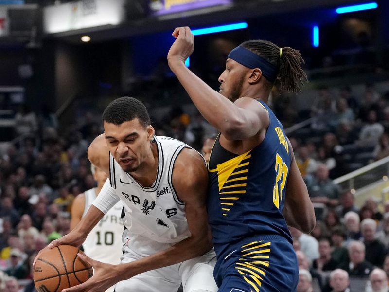 INDIANAPOLIS, INDIANA - NOVEMBER 06: Victor Wembanyama #1 of the San Antonio Spurs dribbles the ball while being guarded by Myles Turner #33 of the Indiana Pacers in the first quarter at Gainbridge Fieldhouse on November 06, 2023 in Indianapolis, Indiana. NOTE TO USER: User expressly acknowledges and agrees that, by downloading and or using this photograph, User is consenting to the terms and conditions of the Getty Images License Agreement. (Photo by Dylan Buell/Getty Images)