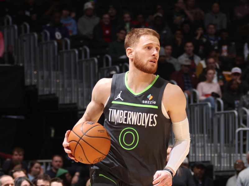 WASHINGTON, DC -?JANUARY 13:  Donte DiVincenzo #0 of the Minnesota Timberwolves dribbles the ball during the game against the Washington Wizards on January 13, 2025 at Capital One Arena in Washington, DC. NOTE TO USER: User expressly acknowledges and agrees that, by downloading and or using this Photograph, user is consenting to the terms and conditions of the Getty Images License Agreement. Mandatory Copyright Notice: Copyright 2024 NBAE (Photo by Kenny Giarla/NBAE via Getty Images)