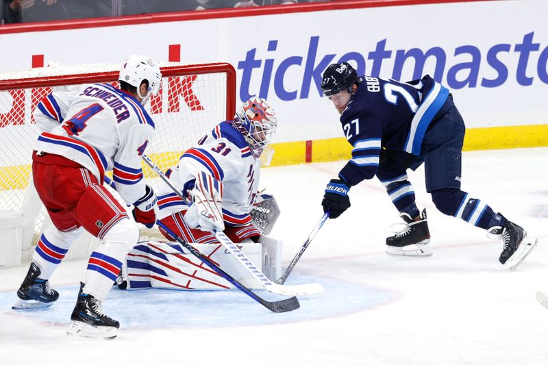 Oct 30, 2023; Winnipeg, Manitoba, CAN; Winnipeg Jets left wing Nikolaj Ehlers (27) scores on New York Rangers goaltender Igor Shesterkin (31) in the third period at Canada Life Centre. Mandatory Credit: James Carey Lauder-USA TODAY Sports