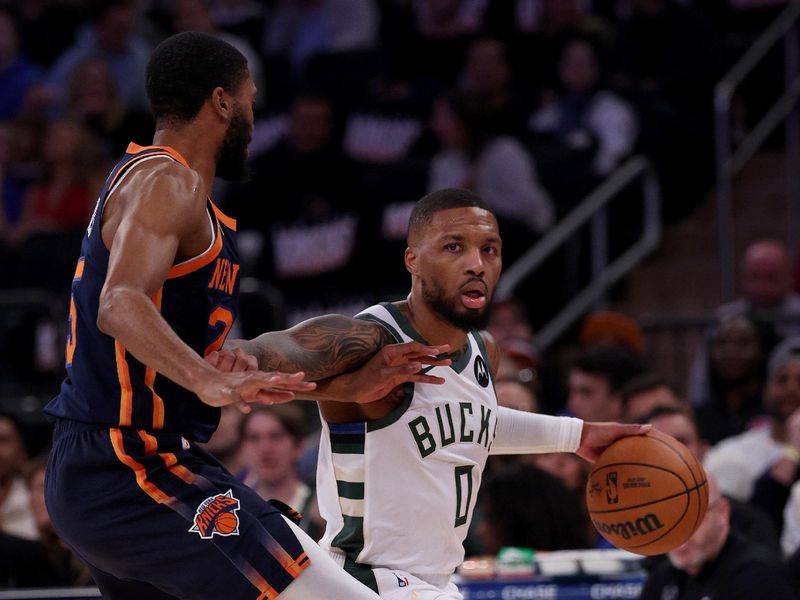 NEW YORK, NEW YORK - NOVEMBER 08:  Damian Lillard #0 of the Milwaukee Bucks heads for the net as Mikal Bridges #25 of the New York Knicks defends at Madison Square Garden on November 08, 2024 in New York City. NOTE TO USER: User expressly acknowledges and agrees that, by downloading and or using this photograph, User is consenting to the terms and conditions of the Getty Images License Agreement. (Photo by Elsa/Getty Images)