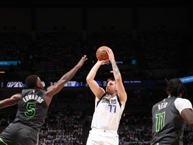 MINNEAPOLIS, MN - MAY 30: Luka Doncic #77 of the Dallas Mavericks shoots the ball during the game against the Minnesota Timberwolves during Round 3 Game 5 of the 2024 NBA Playoffs on May 30, 2024 at Target Center in Minneapolis, Minnesota. NOTE TO USER: User expressly acknowledges and agrees that, by downloading and or using this Photograph, user is consenting to the terms and conditions of the Getty Images License Agreement. Mandatory Copyright Notice: Copyright 2024 NBAE (Photo by Joe Murphy/NBAE via Getty Images)