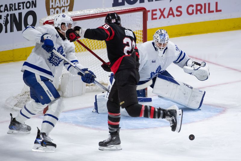 Feb 10, 2024; Ottawa, Ontario, CAN; Toronto Maple Leafs goalie Martin Jones (31) makes a save on a shot from  Ottawa Senators right wing Claude Giroux (28) in the third period at the Canadian Tire Centre. Mandatory Credit: Marc DesRosiers-USA TODAY Sports