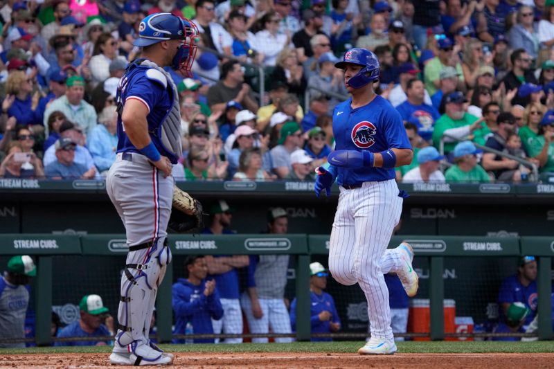 Mar 17, 2024; Mesa, Arizona, USA; Chicago Cubs catcher Miguel Amaya (9) scores a run against the Texas Rangers in the third inning at Sloan Park. Mandatory Credit: Rick Scuteri-USA TODAY Sports