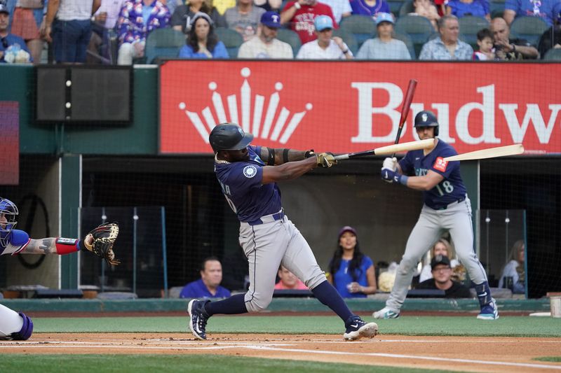 May 3, 2025; Arlington, Texas, USA; Seattle Mariners manager Dan Wilson (6) breaks his bat on a foul ball during the first inning against the Texas Rangers at Globe Life Field. Mandatory Credit: Raymond Carlin III-Imagn Images
