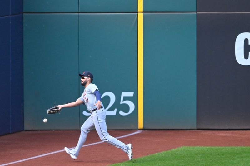 Oct 12, 2024; Cleveland, Ohio, USA; Detroit Tigers outfielder Riley Greene (31) is unable to catch the ball in the third inning against the Cleveland Guardians during game five of the ALDS for the 2024 MLB Playoffs at Progressive Field. Mandatory Credit: David Richard-Imagn Images