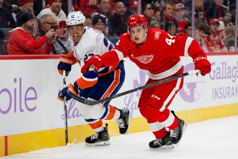 Nov 20, 2025; Detroit, Michigan, USA;  New York Islanders left wing Anders Lee (27) and Detroit Red Wings defenseman Axel Sandin-Pellikka (44) fight for position in the first period at Little Caesars Arena. Mandatory Credit: Rick Osentoski-Imagn Images