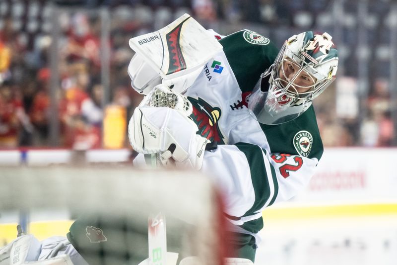 Nov 23, 2024; Calgary, Alberta, CAN; Minnesota Wild goaltender Filip Gustavsson (32) warms up before a game against the Calgary Flames at Scotiabank Saddledome. Mandatory Credit: Brett Holmes-Imagn Images