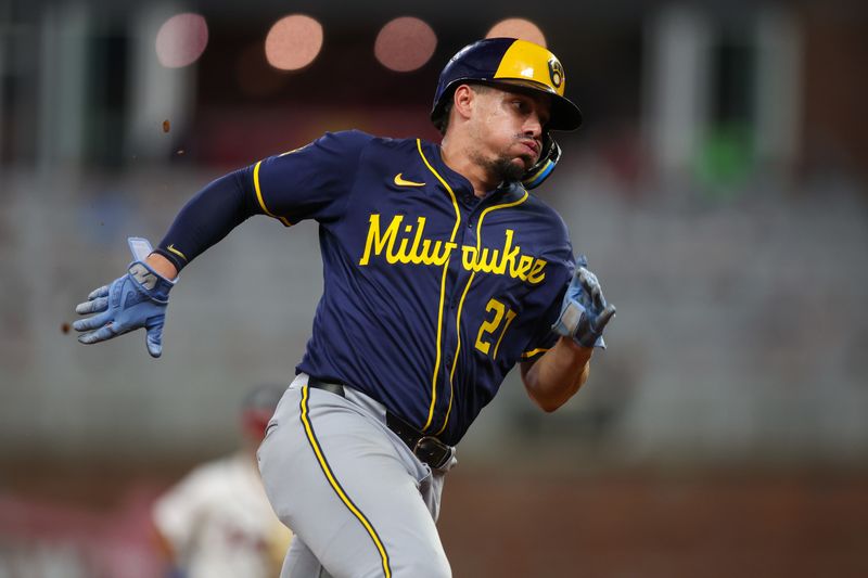 Aug 7, 2024; Atlanta, Georgia, USA; Milwaukee Brewers shortstop Willy Adames (27) scores a run against the Atlanta Braves in the eighth inning at Truist Park. Mandatory Credit: Brett Davis-USA TODAY Sports