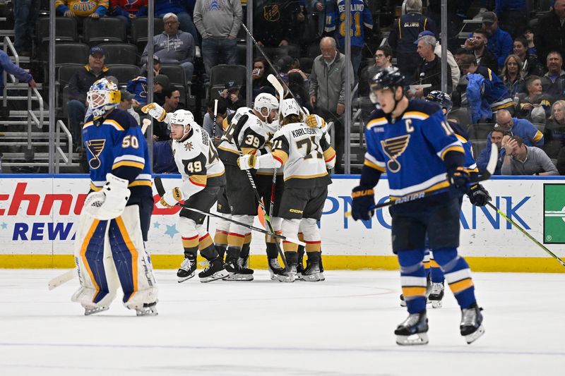 Mar 25, 2024; St. Louis, Missouri, USA;  Vegas Golden Knights right wing Jonathan Marchessault (81) is congratulated by teammates after scoring the game winning goal against goaltender Jordan Binnington (50) in overtime at Enterprise Center. Mandatory Credit: Jeff Curry-USA TODAY Sports