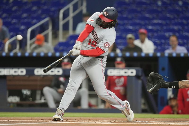 Sep 9, 2025; Miami, Florida, USA;  Washington Nationals first baseman Josh Bell (19) hits a three-run home run in the first inning against the Miami Marlins at loanDepot Park. Mandatory Credit: Jim Rassol-Imagn Images