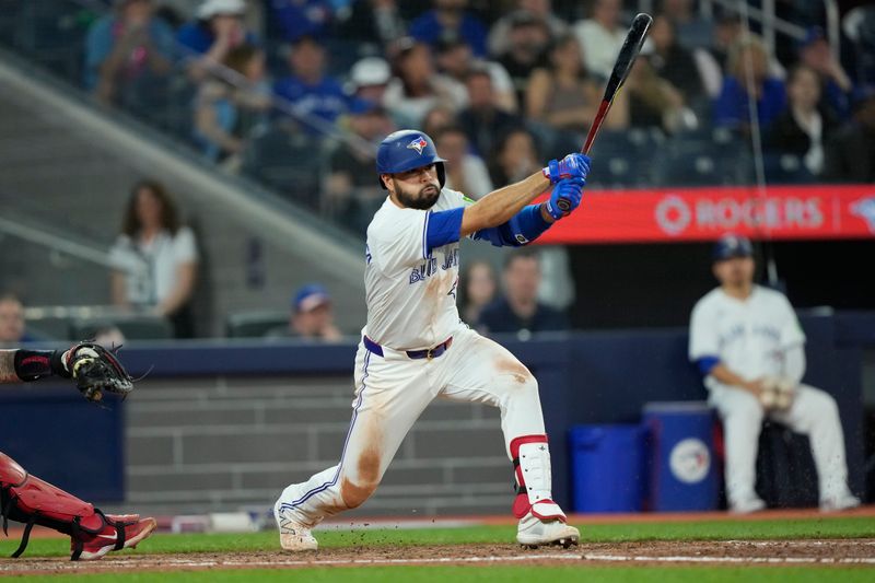 May 10, 2024; Toronto, Ontario, CAN; Toronto Blue Jays second baseman Isiah Kiner-Falefa (7) hits a one-run single against the Minnesota Twins during the ninth inning at Rogers Centre. Mandatory Credit: John E. Sokolowski-USA TODAY Sports